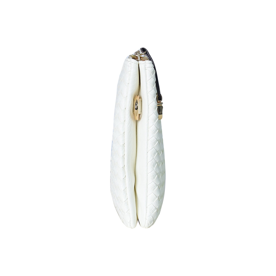 White quilted handbag with gold zipper on a white background