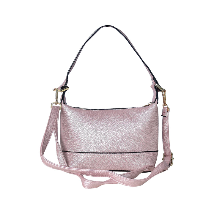 Pink handbag with a strap on a white background