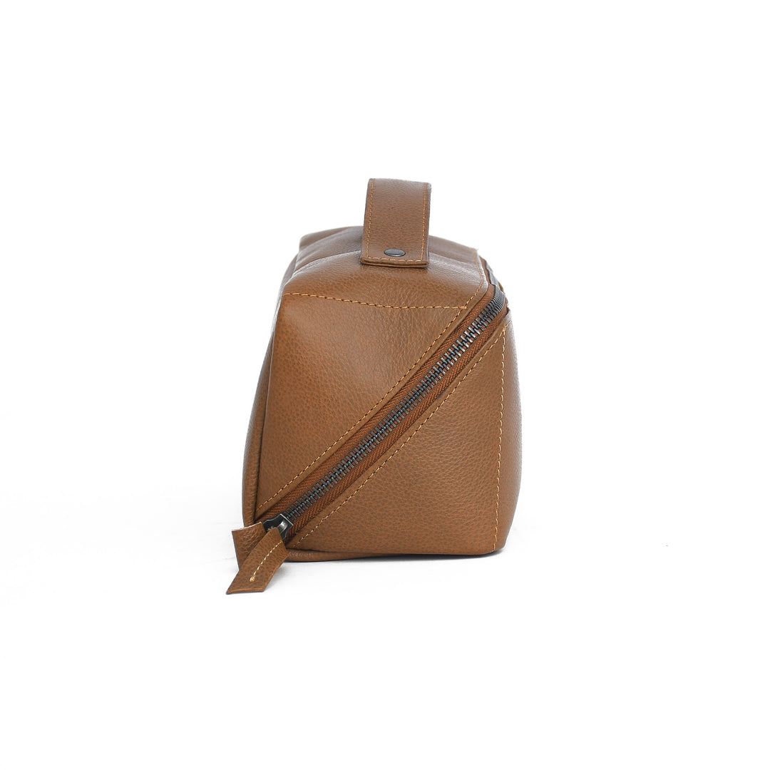 Brown leather Toiletry bag with a strap on a white background