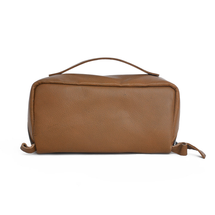 Brown leather toiletry bag on a white background