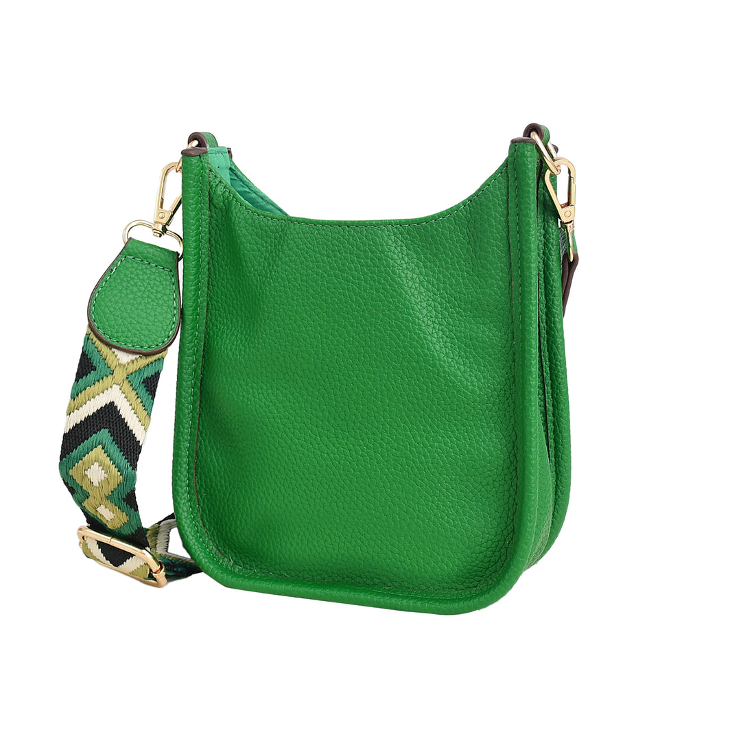 Green leather handbag with a patterned strap on a white background