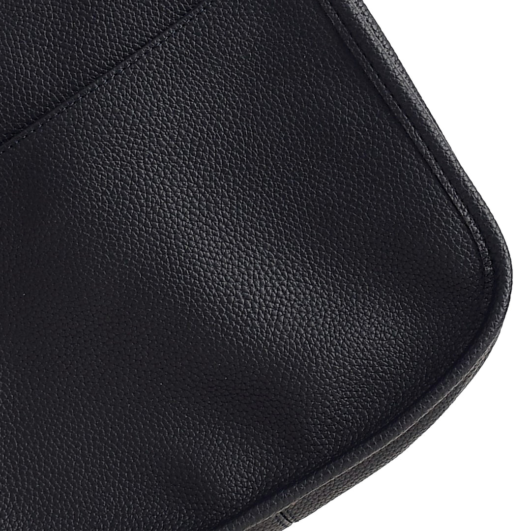 Close-up of a black leather bag on a white background