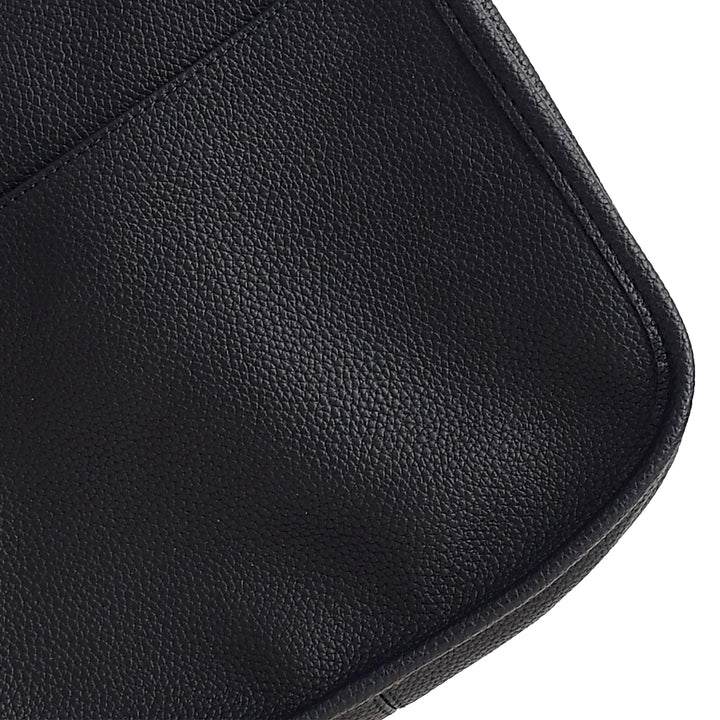 Close-up of a black leather bag on a white background
