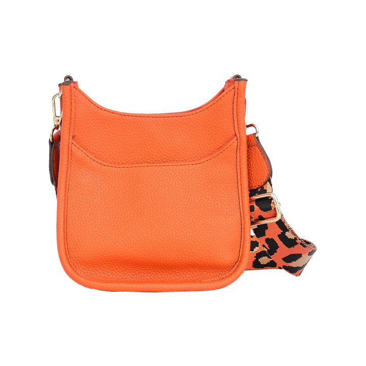 Orange handbag with a leopard print strap on a white background
