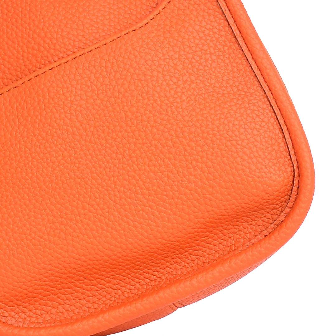 Close-up of an orange leather product on a white background