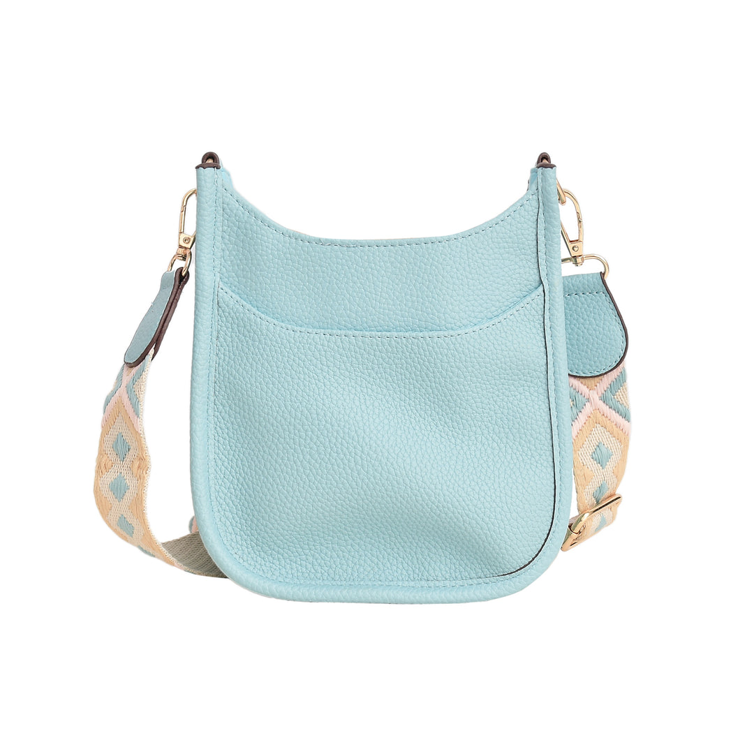 Light blue handbag with a patterned strap on a white background