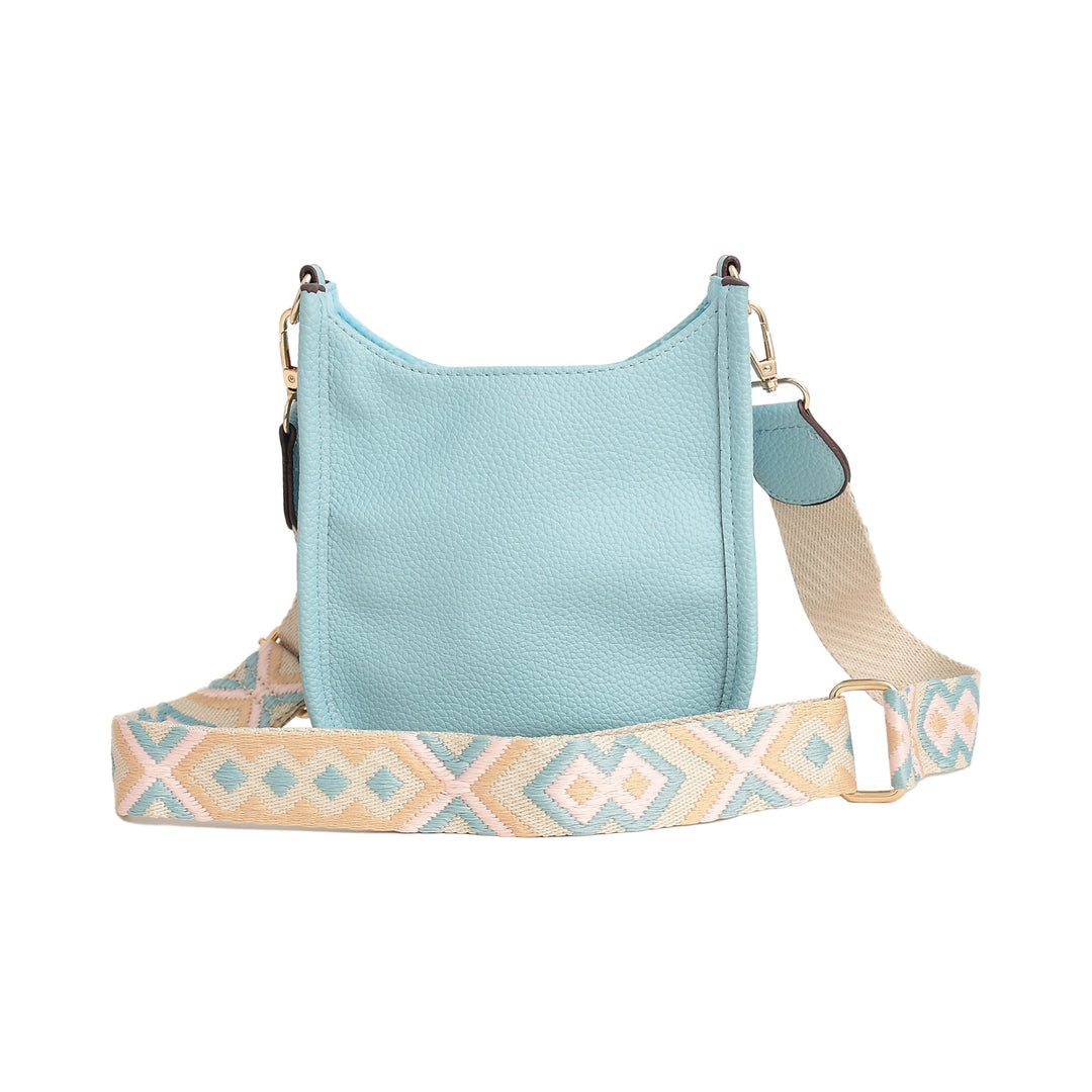 Light blue handbag with a patterned strap on a white background