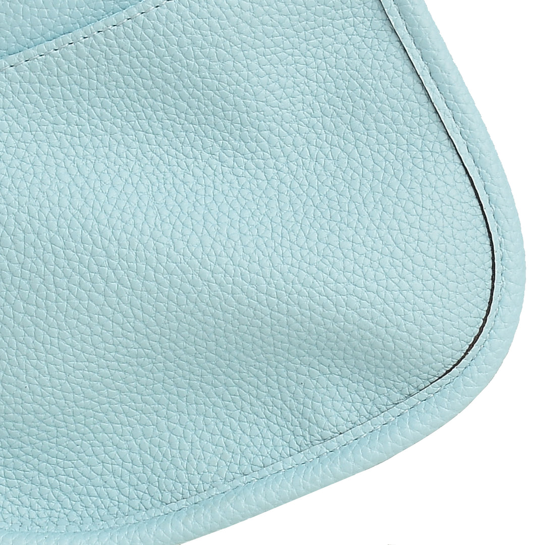 Close-up of a light blue leather product on a white background