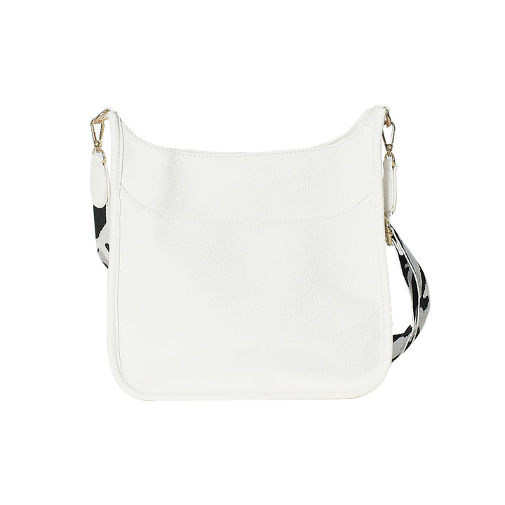 White handbag with black and white patterned strap on a white background