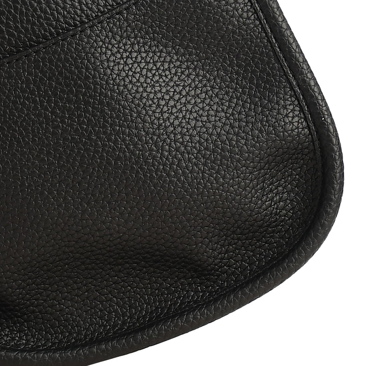 Close-up of a black leather saddle pad with textured surface