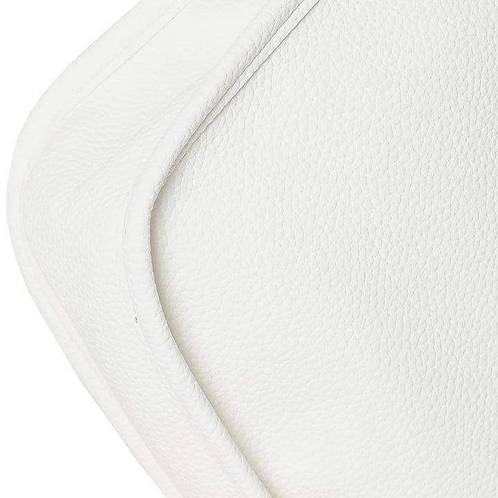 Close-up of a textured white surface with a subtle pattern