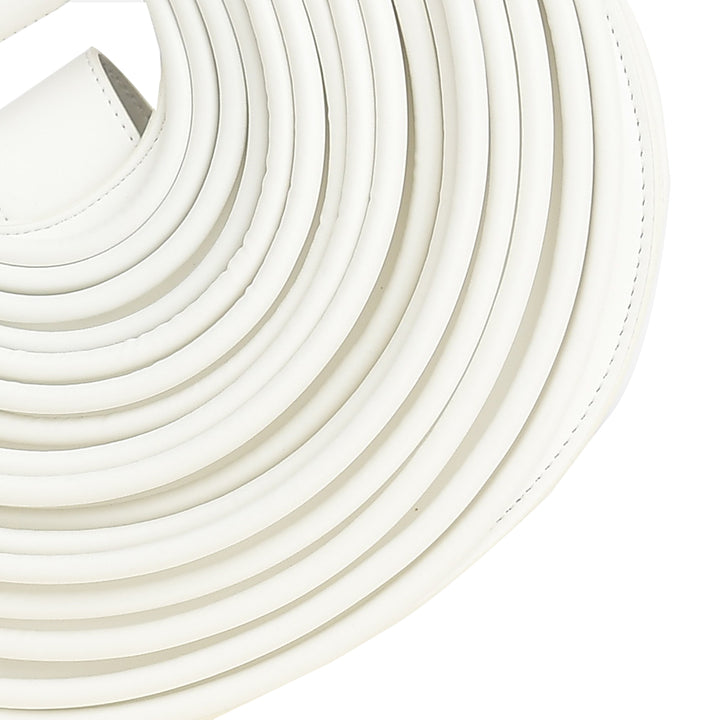 Close-up of white leather belts stacked on a white background