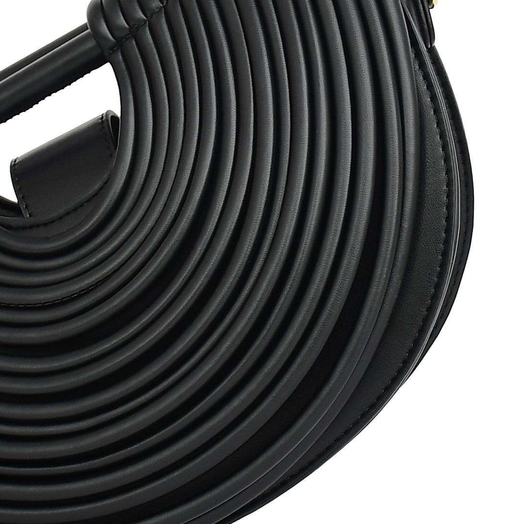 Close-up of a coiled black rubber hose on a white background