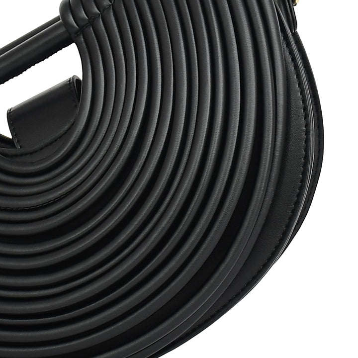 Close-up of a coiled black rubber hose on a white background
