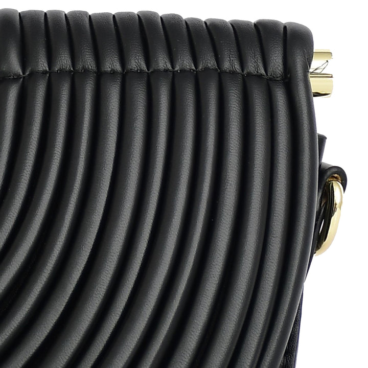 Close-up of a black textured handbag with gold hardware on a white background