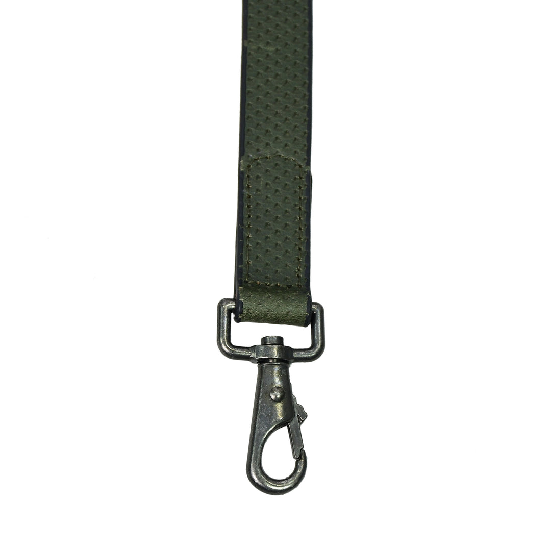 Green strap with a metal clasp on a white background

