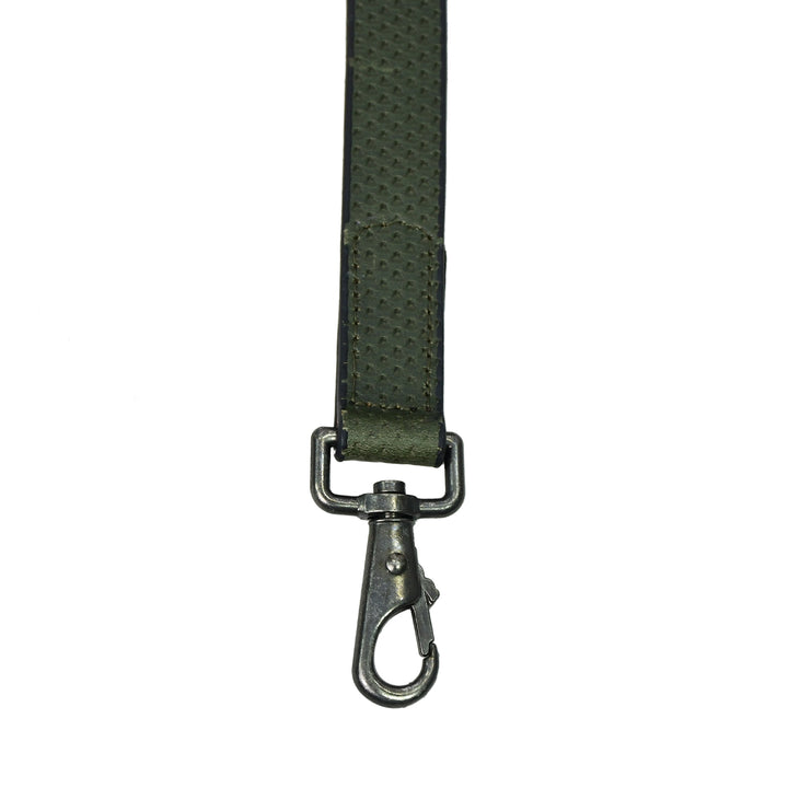 Green strap with a metal clasp on a white background

