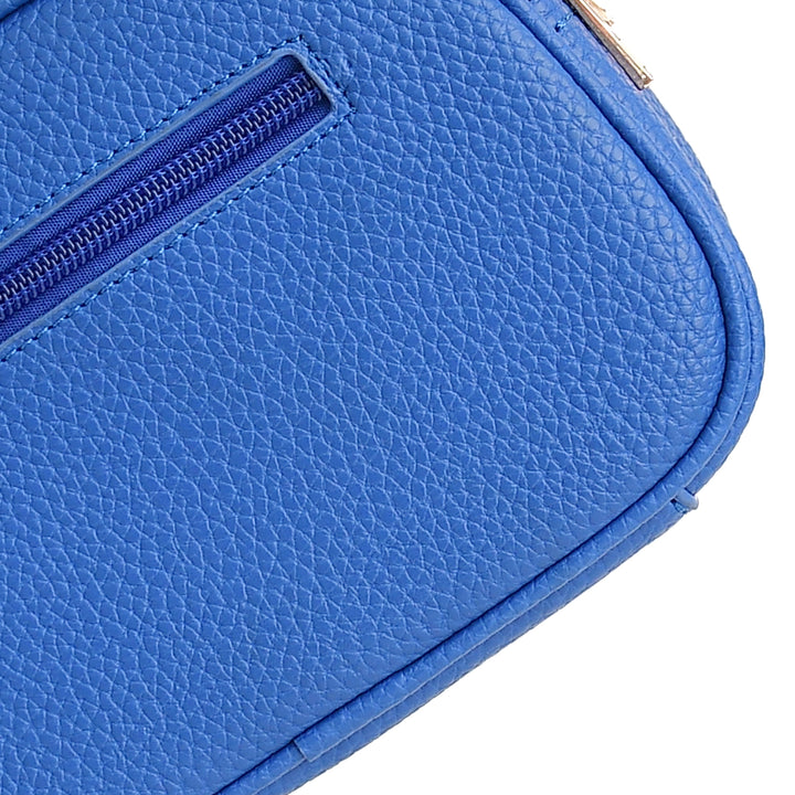 Close-up of a blue textured pouch with a zipper