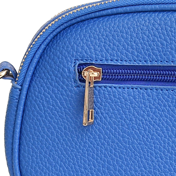 Close-up of a blue leather bag with a gold zipper.