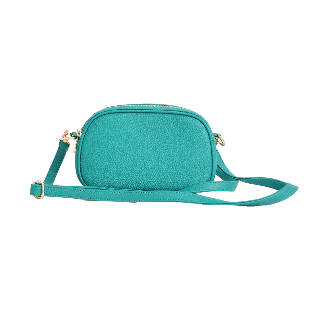 Turquoise crossbody bag on a white background