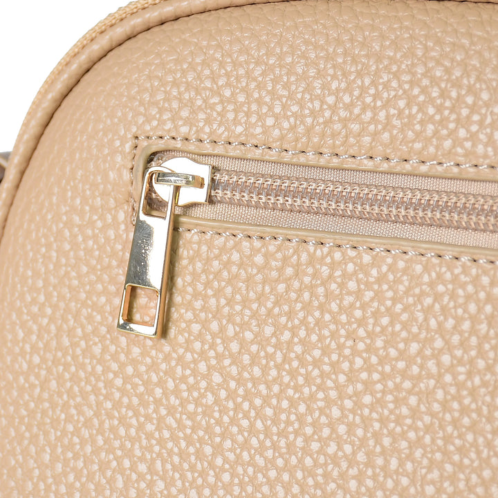 Close-up of a beige textured bag with a zipper