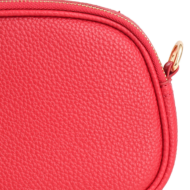 Close-up of a red leather pouch with a gold zipper.