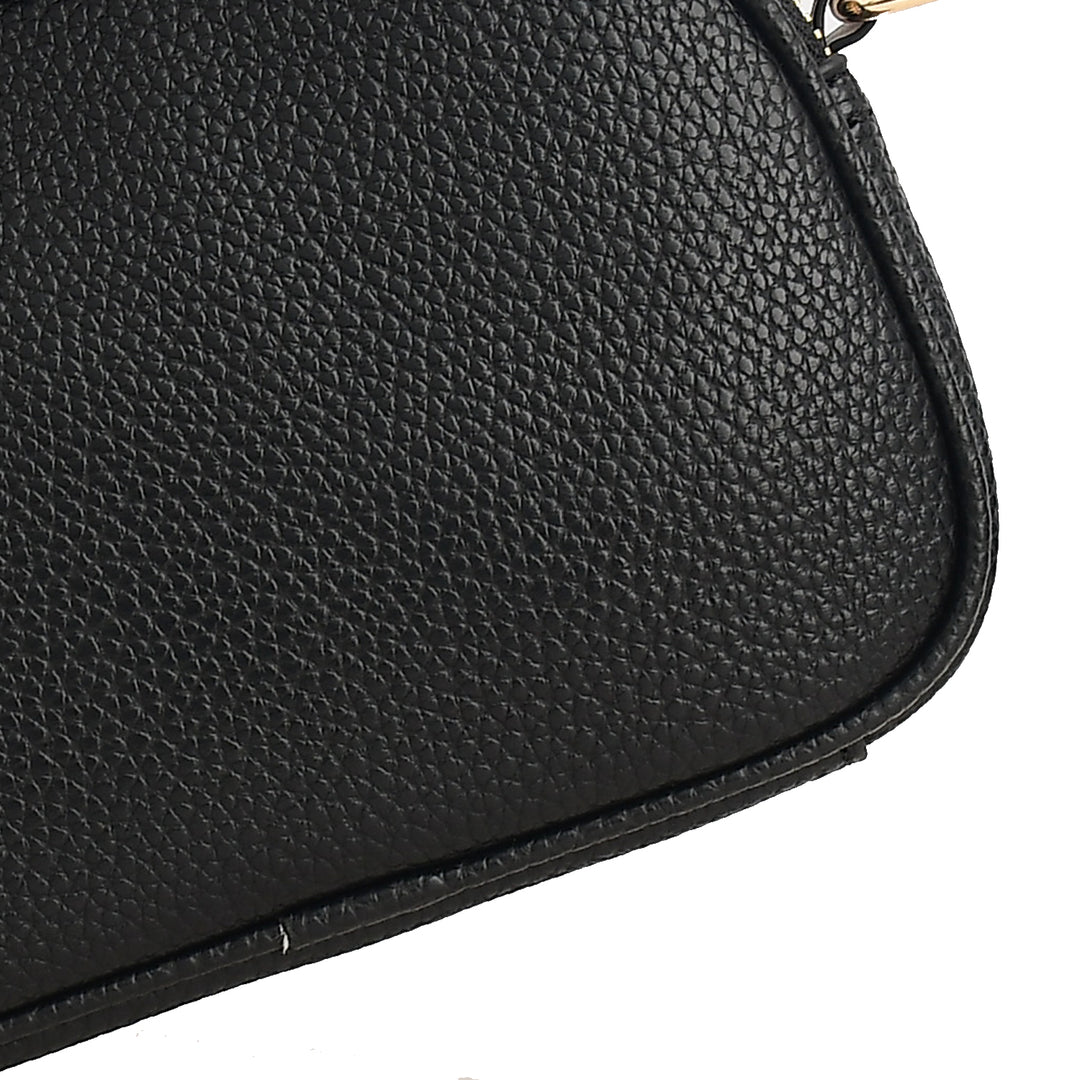 Close-up of a black leather handbag on a white background