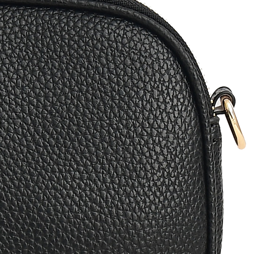 Close-up of a black textured bag with a gold zipper.