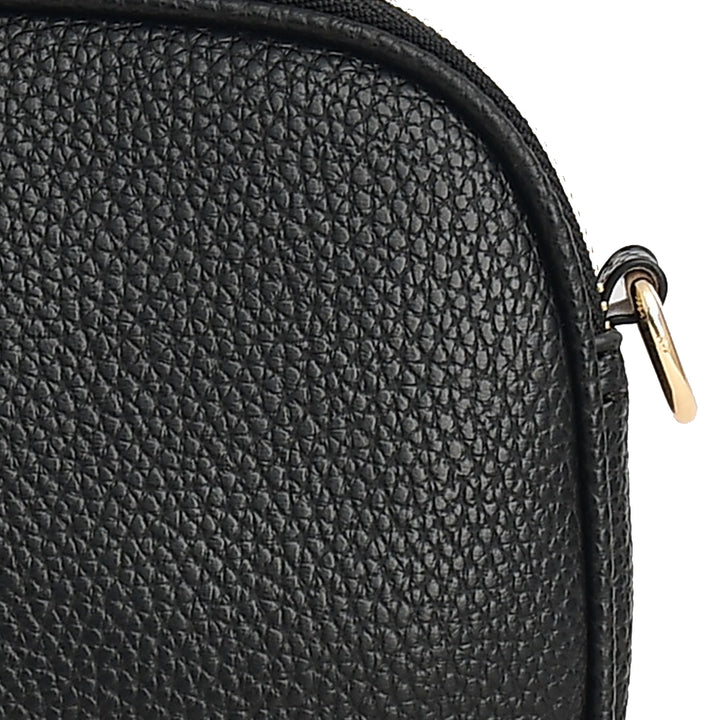 Close-up of a black textured bag with a gold zipper.