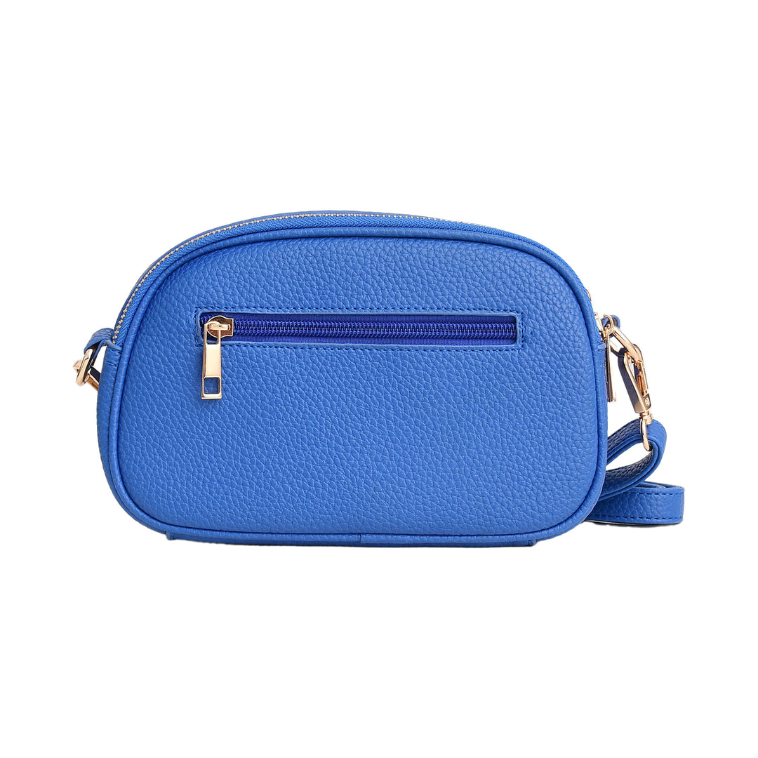 Blue crossbody bag with gold zippers on a white background