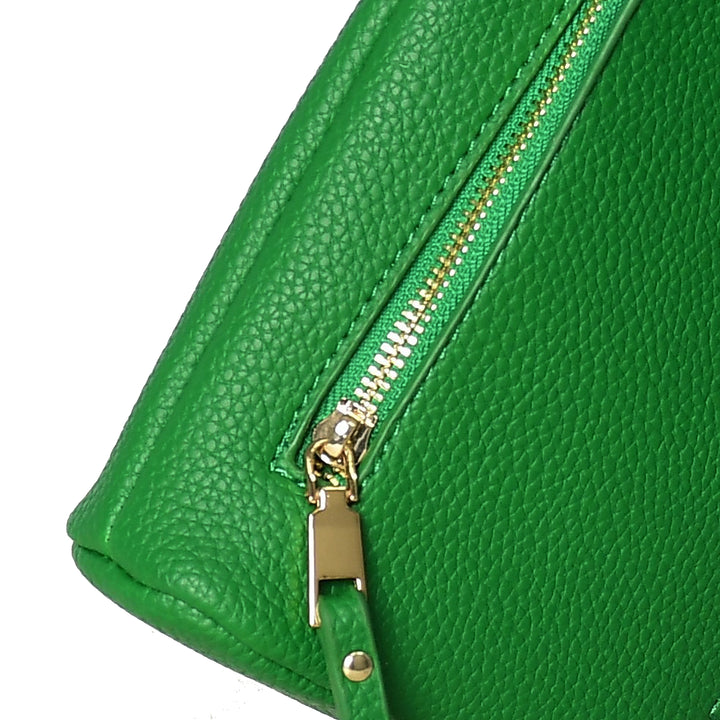 Close-up of a green leather bag with a gold zipper on a white background