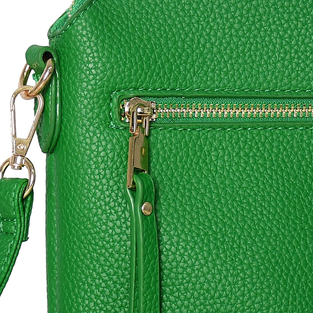Close-up of a green leather handbag with a gold zipper and matching strap.
