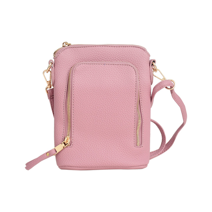 Pink crossbody bag with gold zippers on a white background