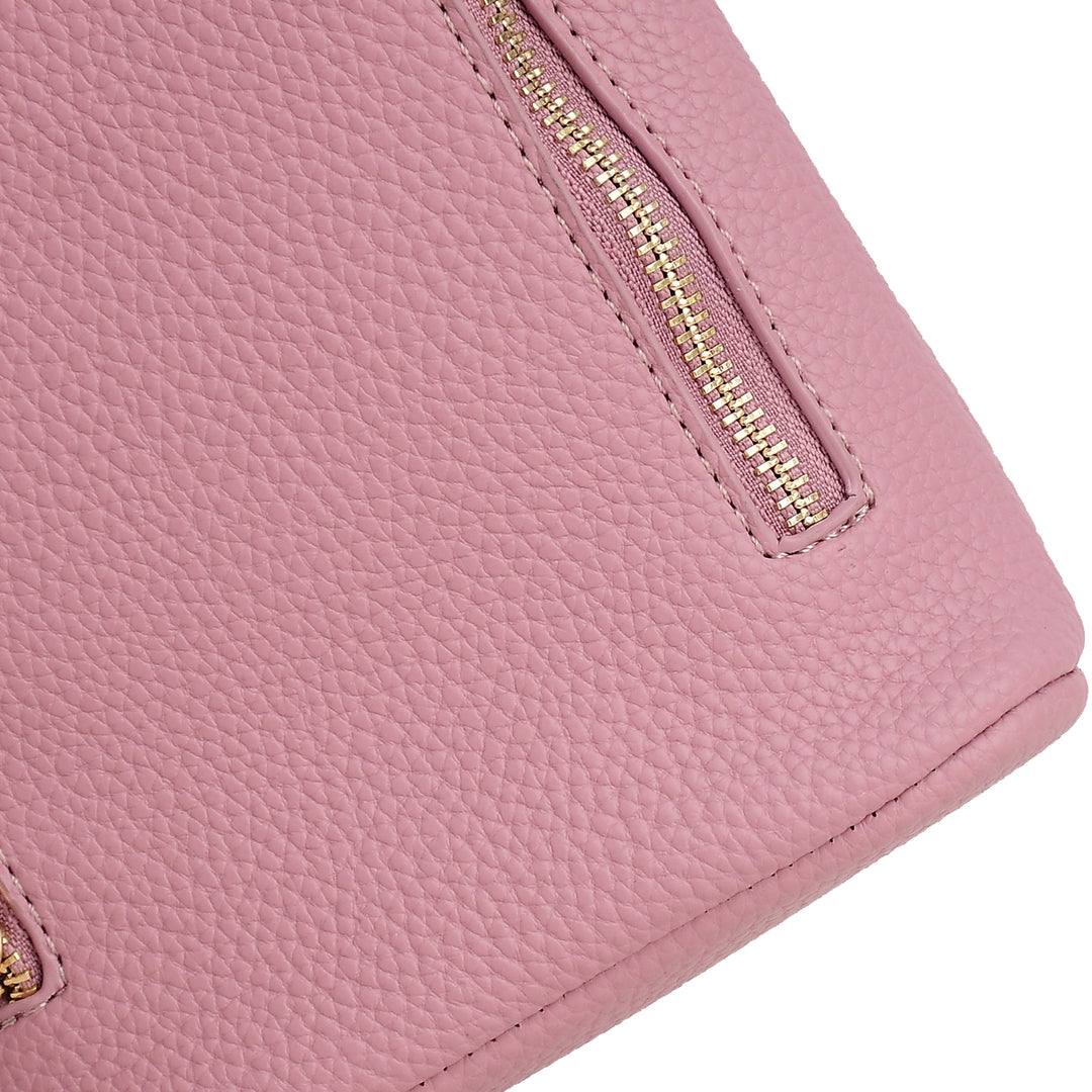 Close-up of a pink wallet with a gold zipper on a white background