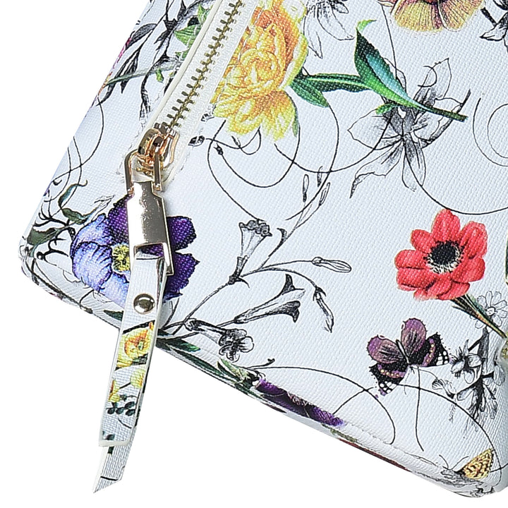 Scissors with floral design on a floral-patterned background