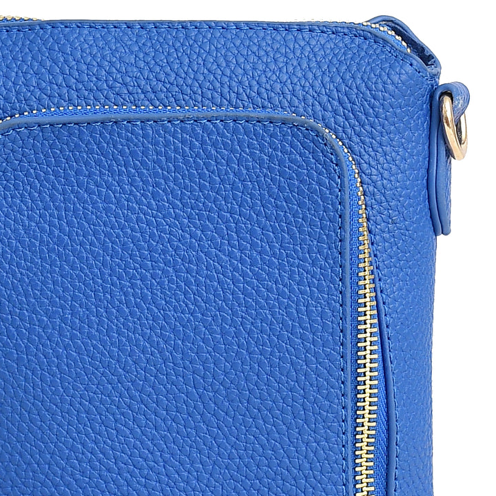 Close-up of a blue leather bag with a gold zipper on a white background