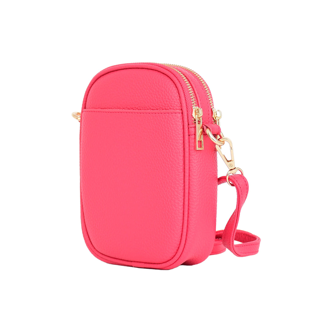 Pink crossbody bag with gold zipper on a white background