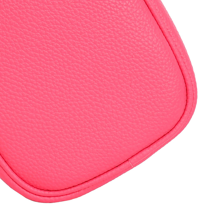 Close-up of a pink leather product on a white background