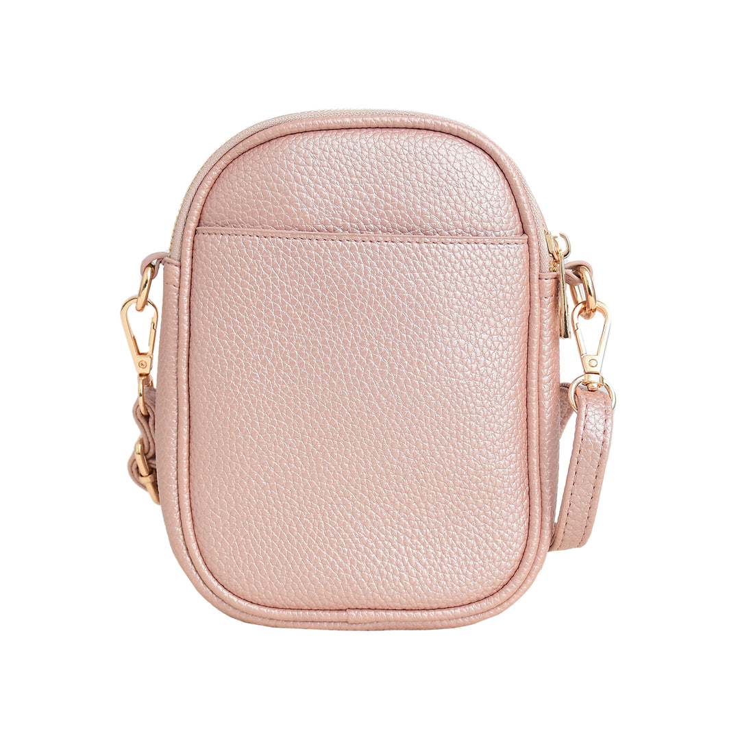 Pink crossbody bag with gold accents on a white background
