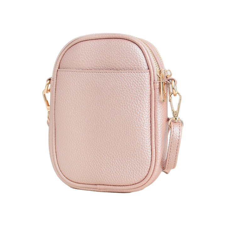 Pink crossbody bag with gold zipper on a white background