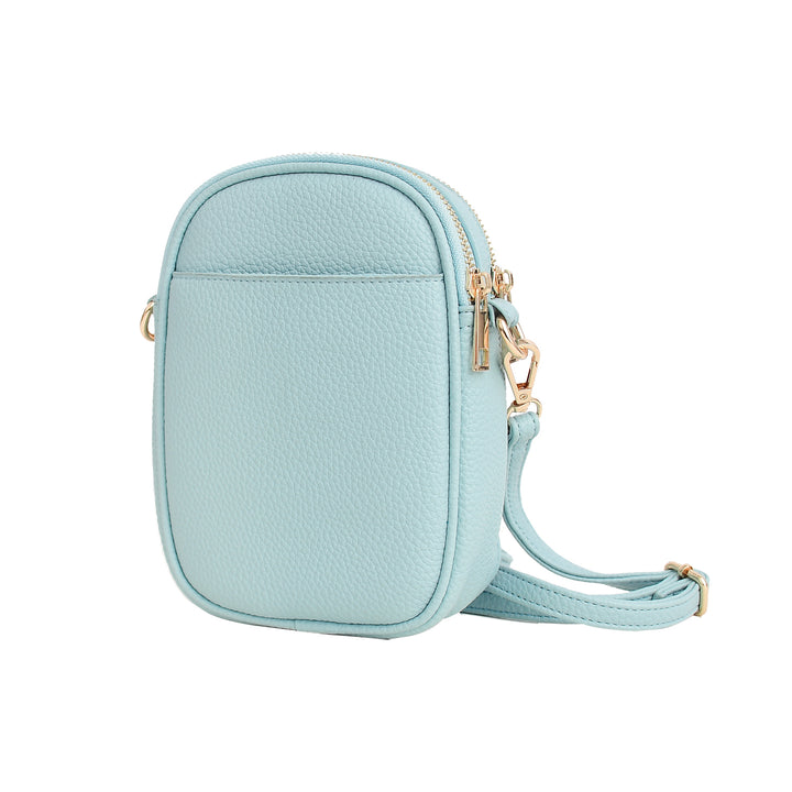 Light blue crossbody bag with gold accents on a white background