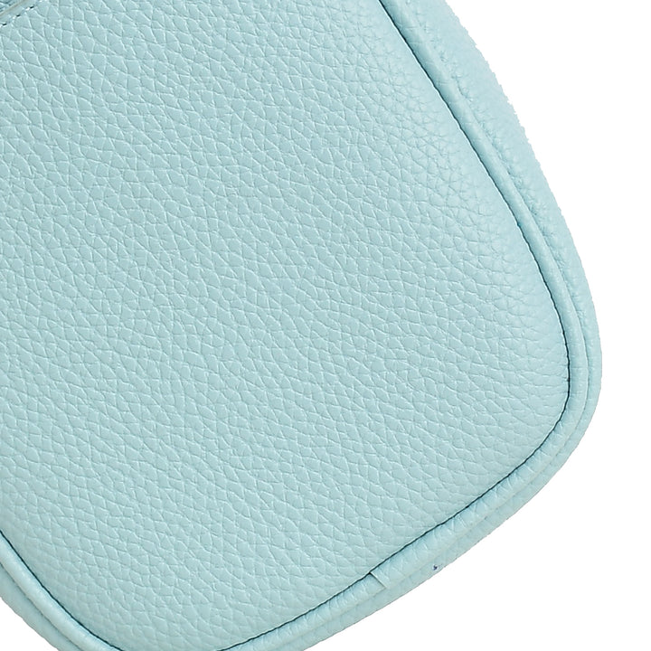 Close-up of a light blue leather product on a white background