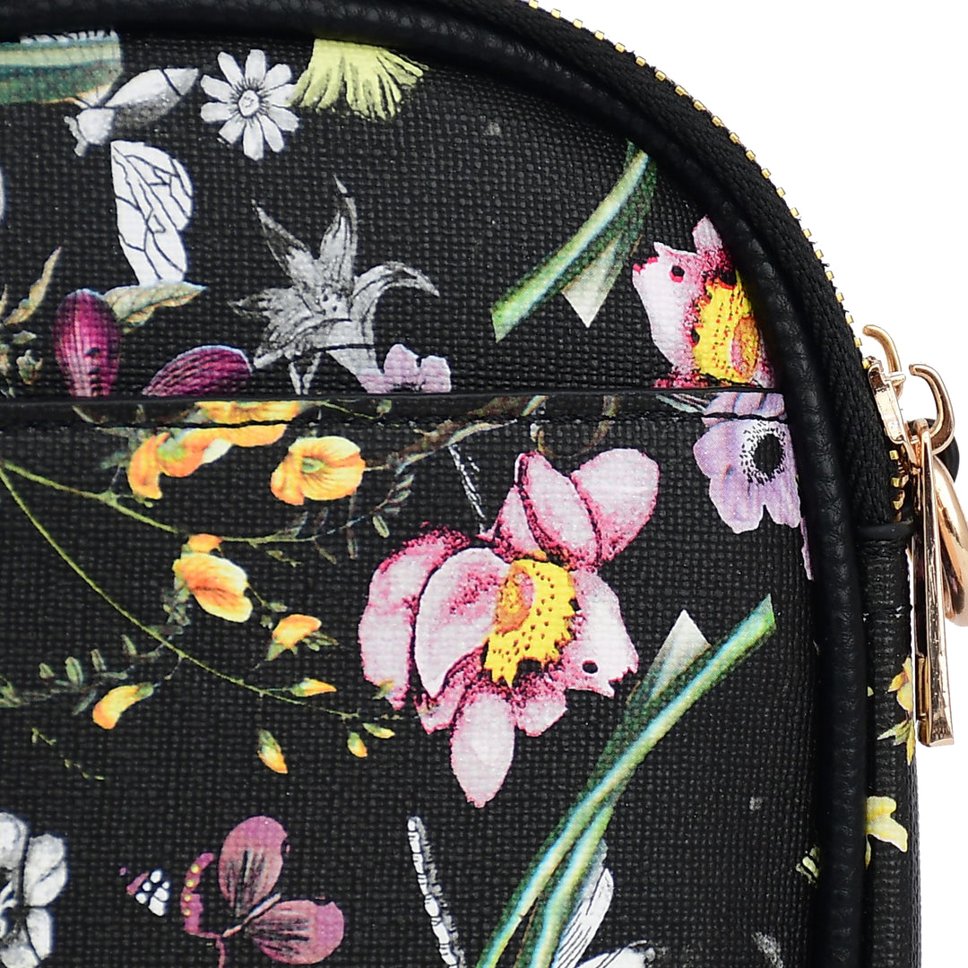 Floral and nature-themed pouch with a gold zipper on a black background