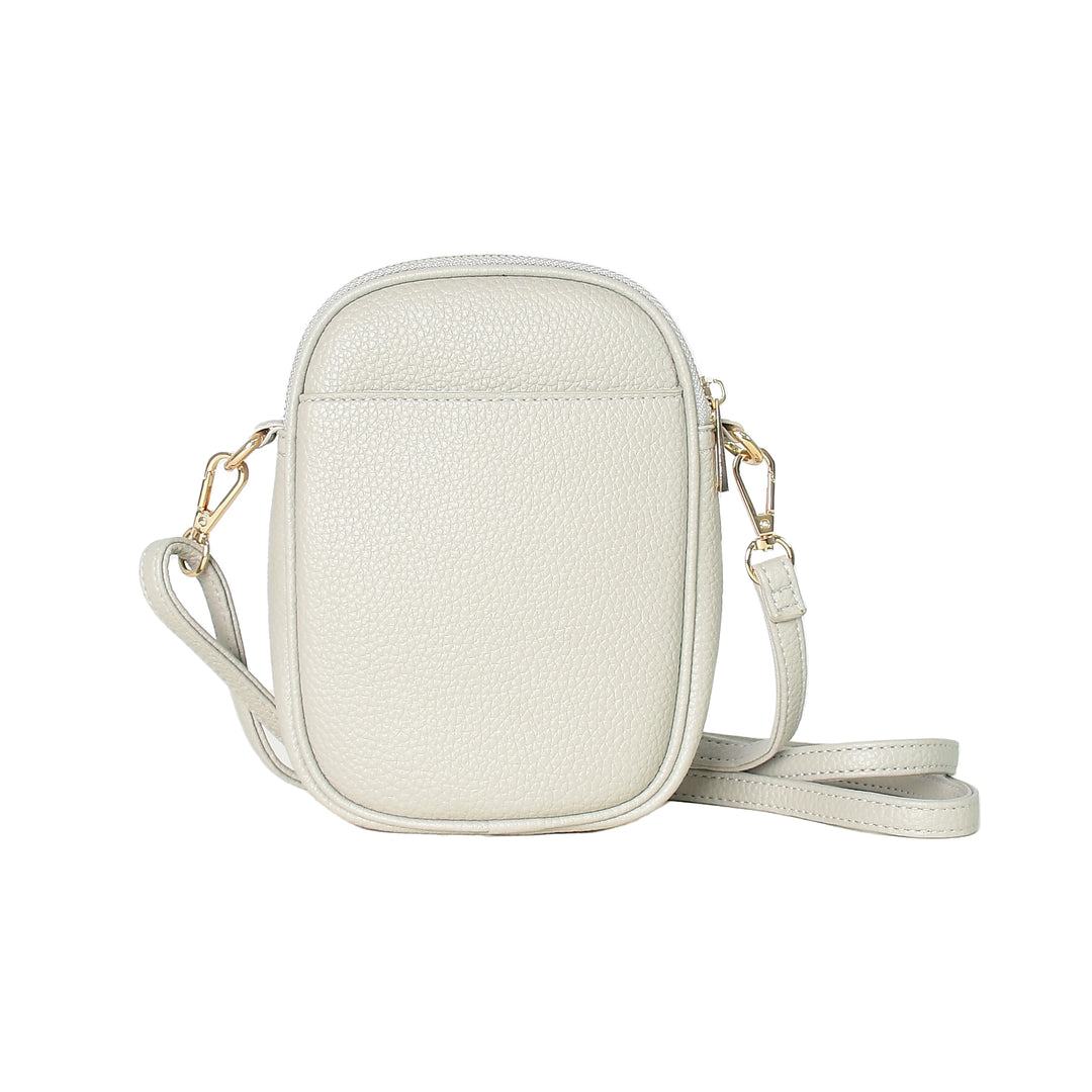 White crossbody bag with gold accents on a white background