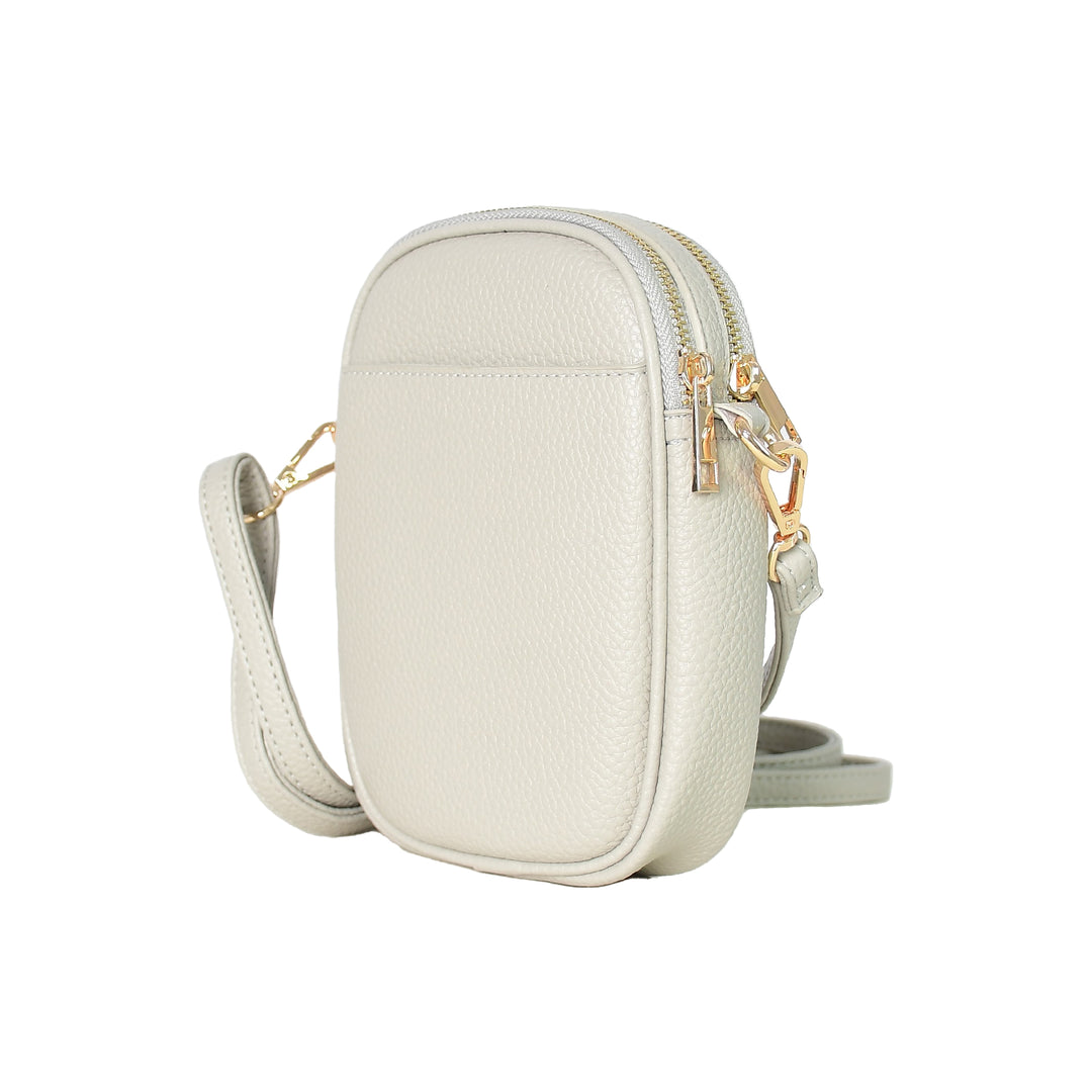White crossbody bag with gold zipper on a white background