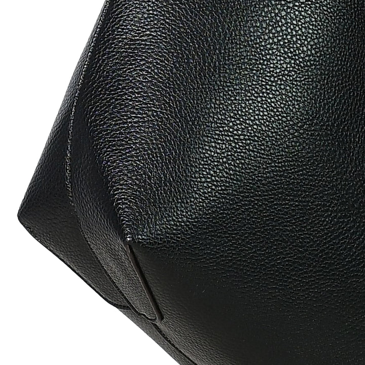 Close-up of a black leather bag with visible texture