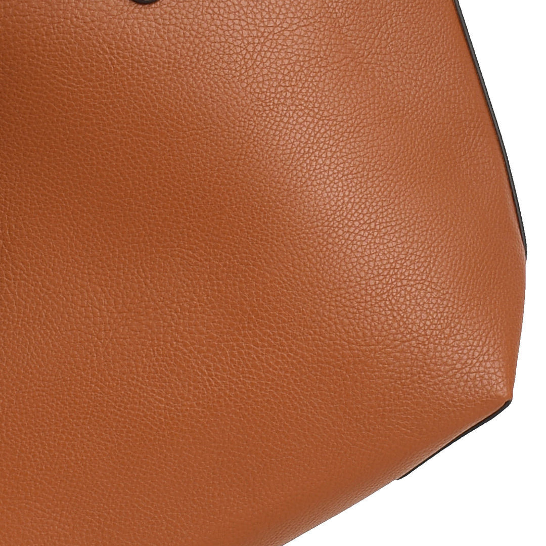 Close-up of a brown leather bag with visible texture