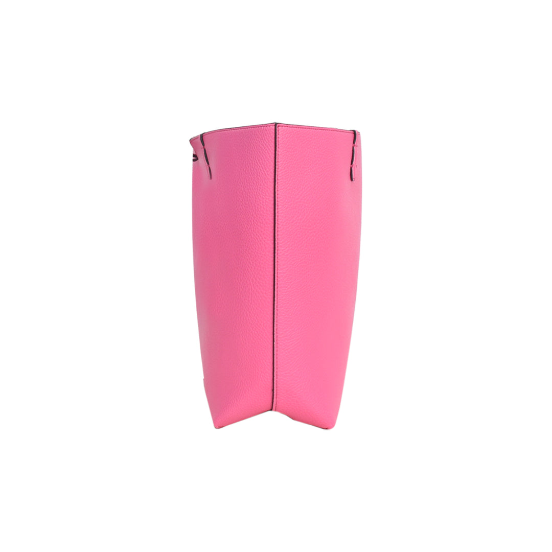 Pink protective shin guard on a white background