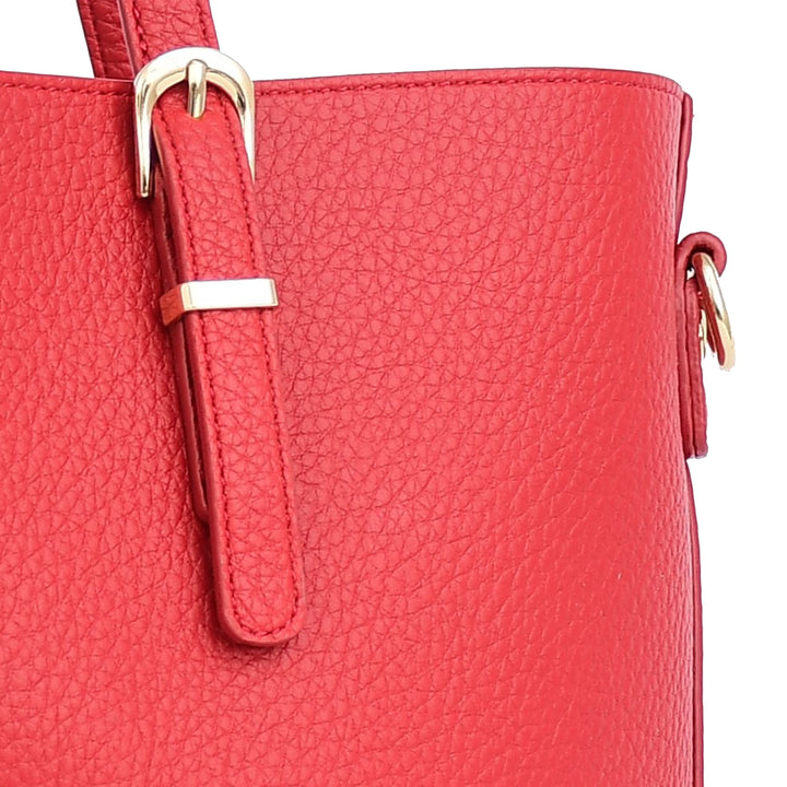 Close-up of a red handbag with a gold buckle on a white background