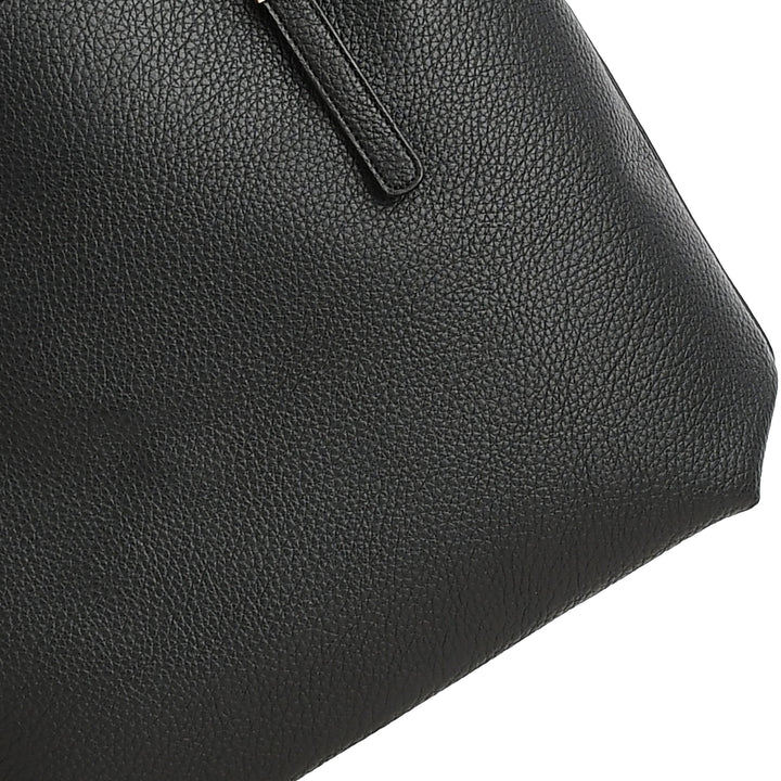 Close-up of a black leather handbag on a white background